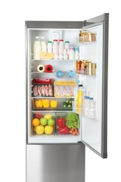 Photo of Open refrigerator with many different products on white background