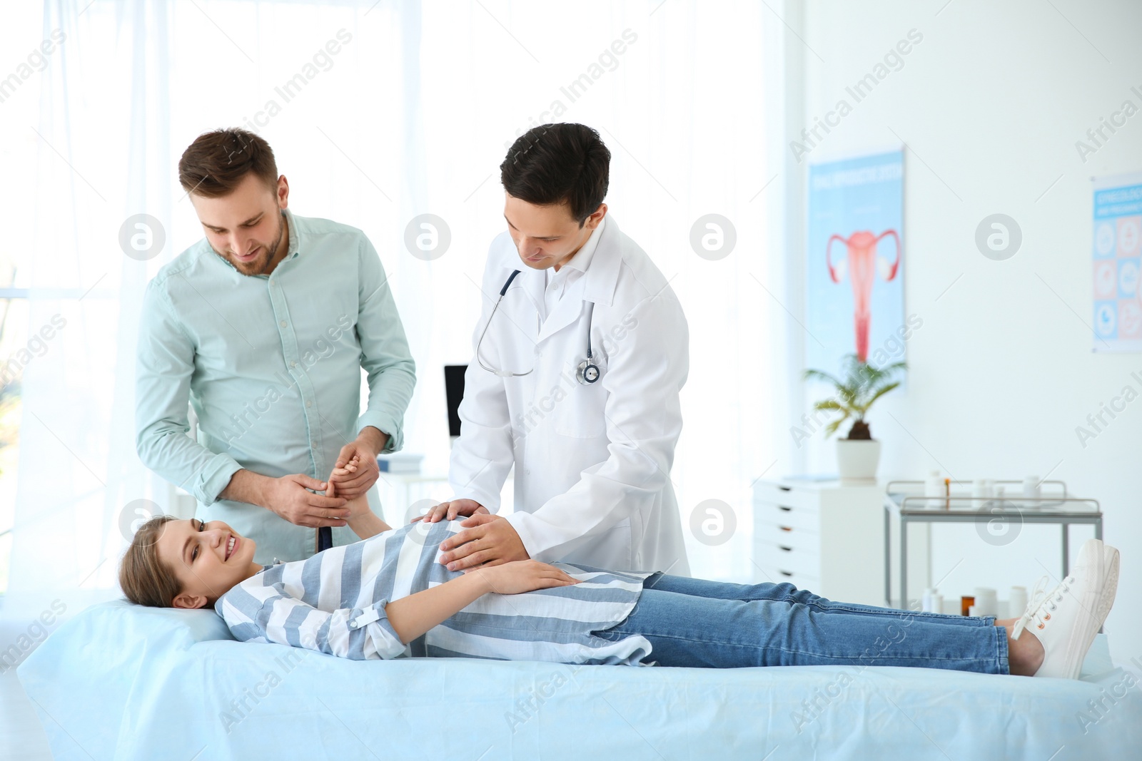 Photo of Gynecology consultation. Pregnant woman with her doctor in clinic