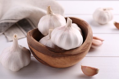 Fresh garlic on white wooden table, closeup