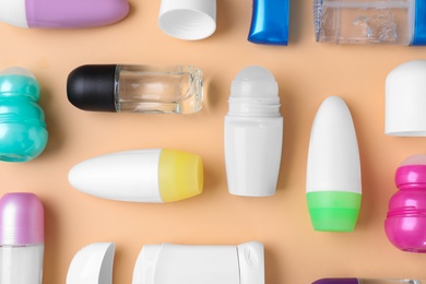Photo of Flat lay composition with different natural deodorants on beige background