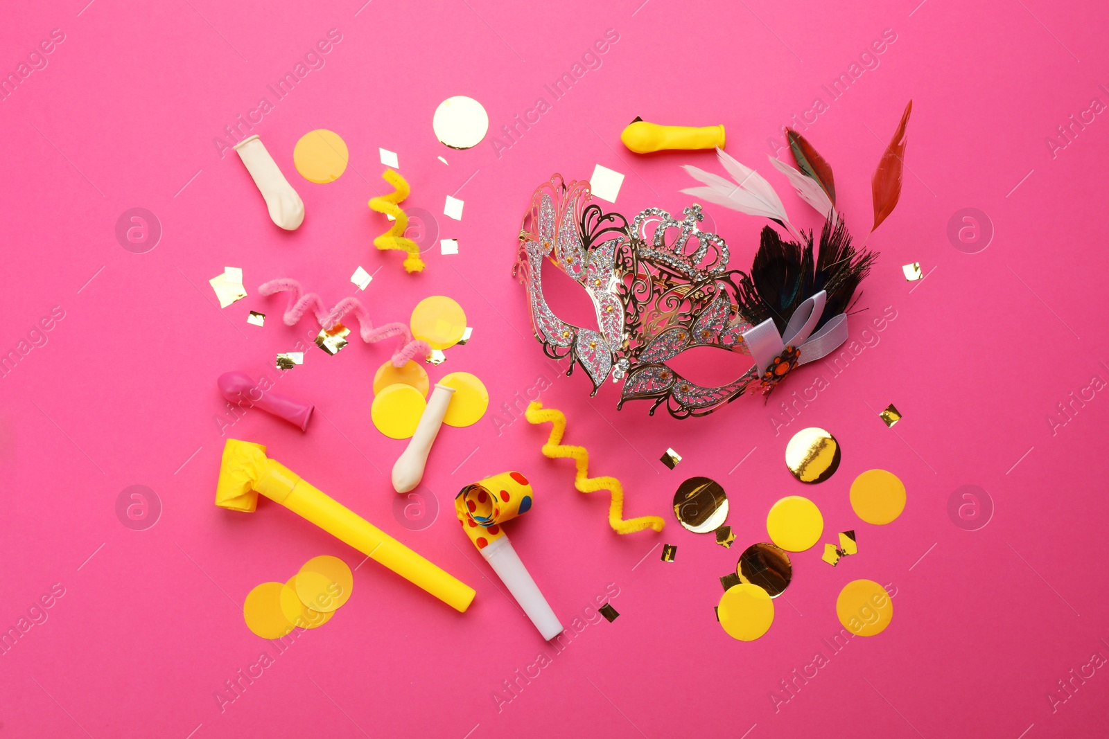 Photo of Flat lay composition with carnival items on pink background