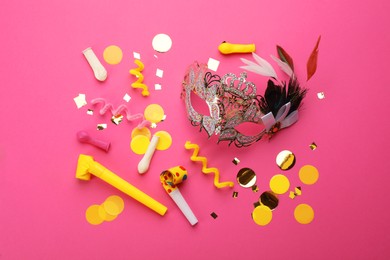 Flat lay composition with carnival items on pink background