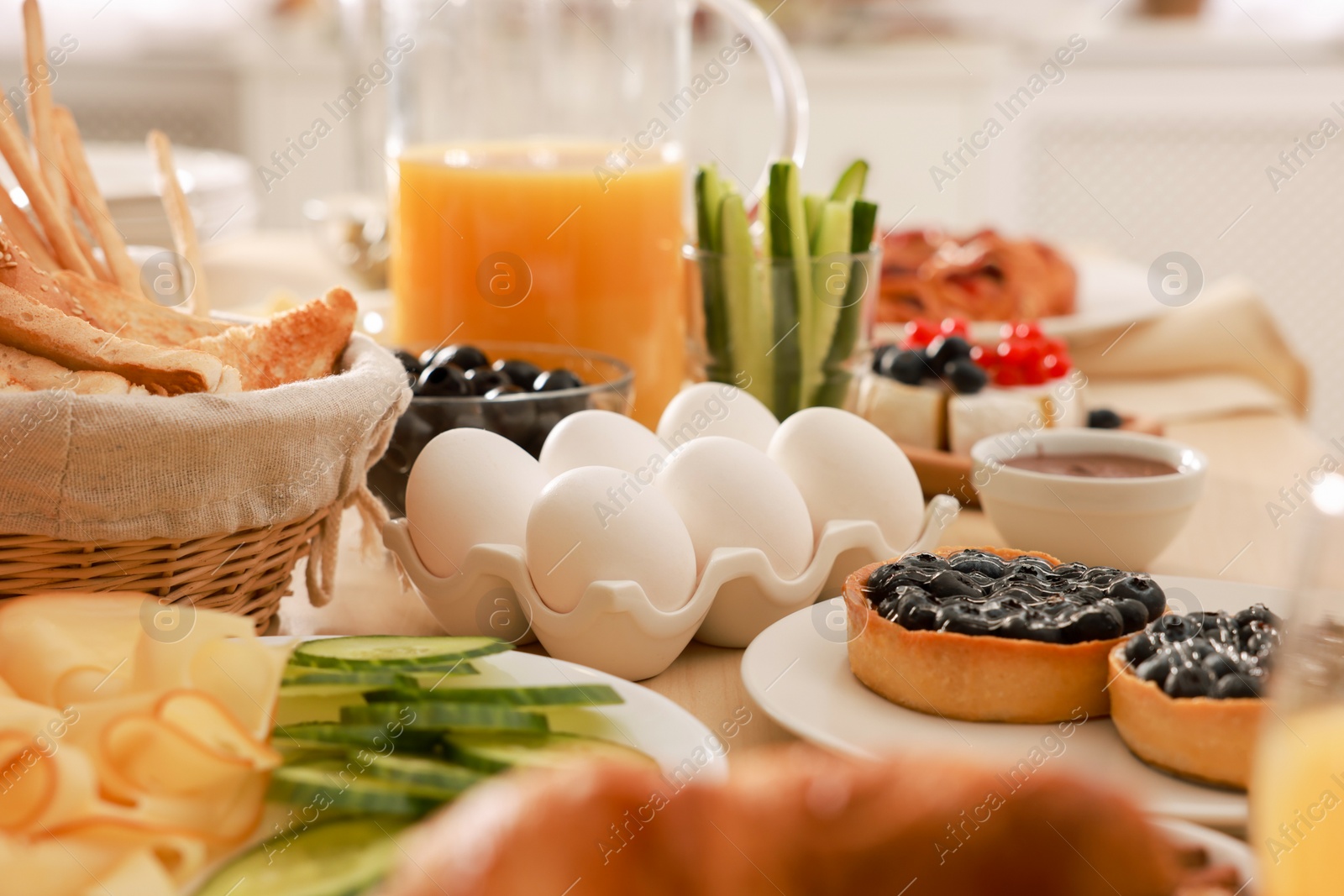 Photo of Dishes with different food on table in room. Luxury brunch