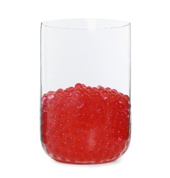 Photo of Red filler in glass vase isolated on white. Water beads