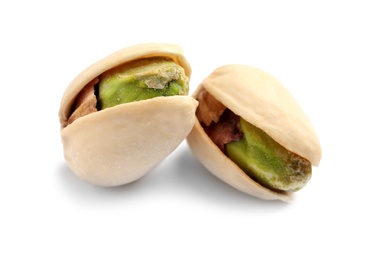 Photo of Tasty organic pistachio nuts on white background, closeup