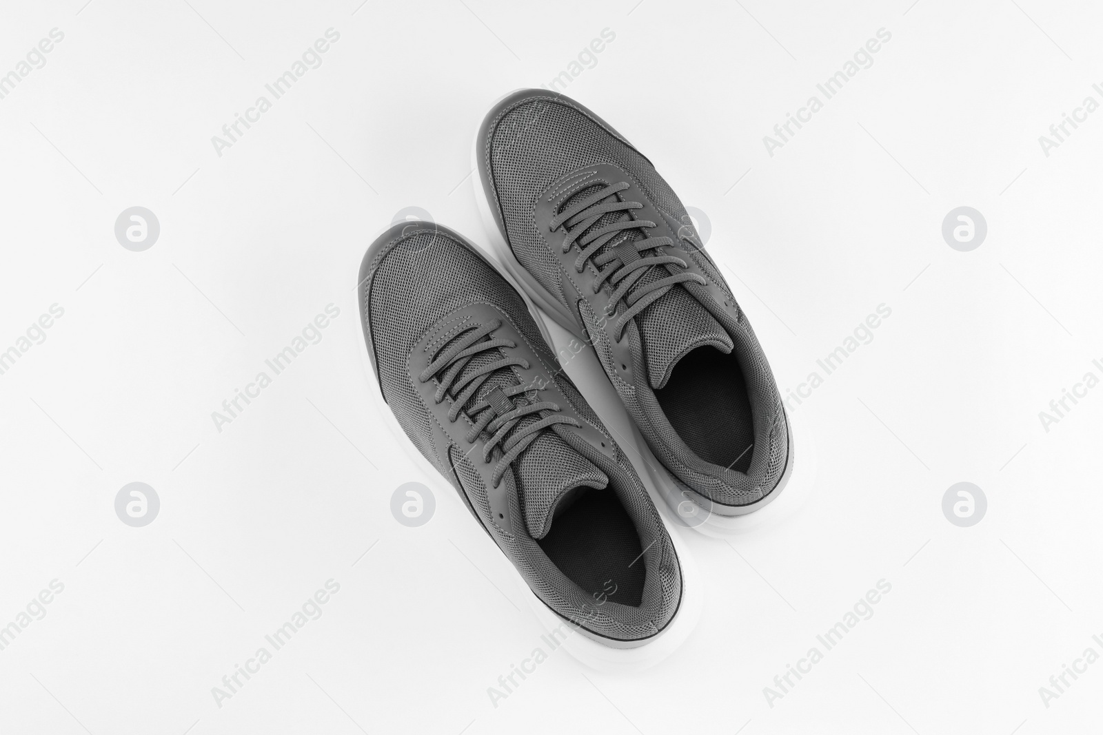 Photo of Pair of stylish sport shoes on white background, top view