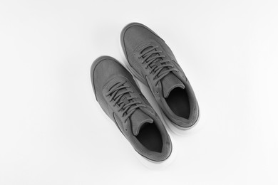 Photo of Pair of stylish sport shoes on white background, top view
