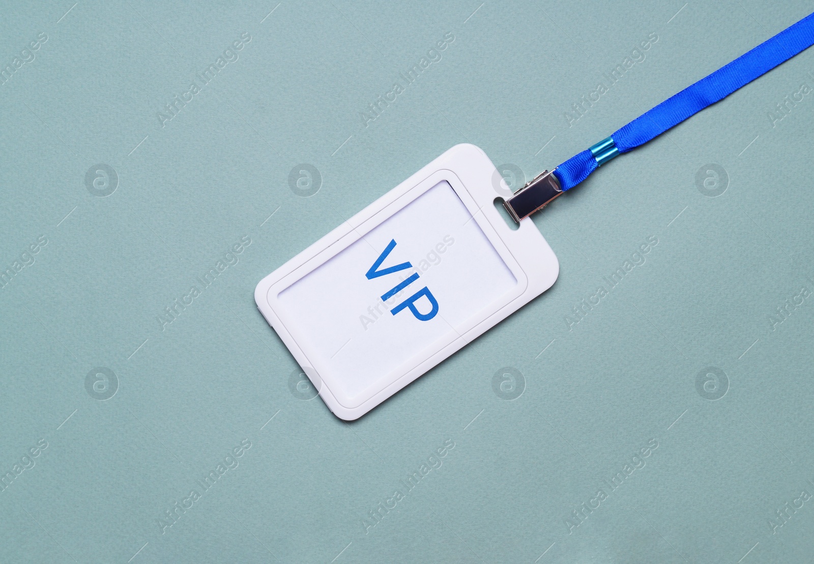 Photo of Plastic vip badge on light background, top view