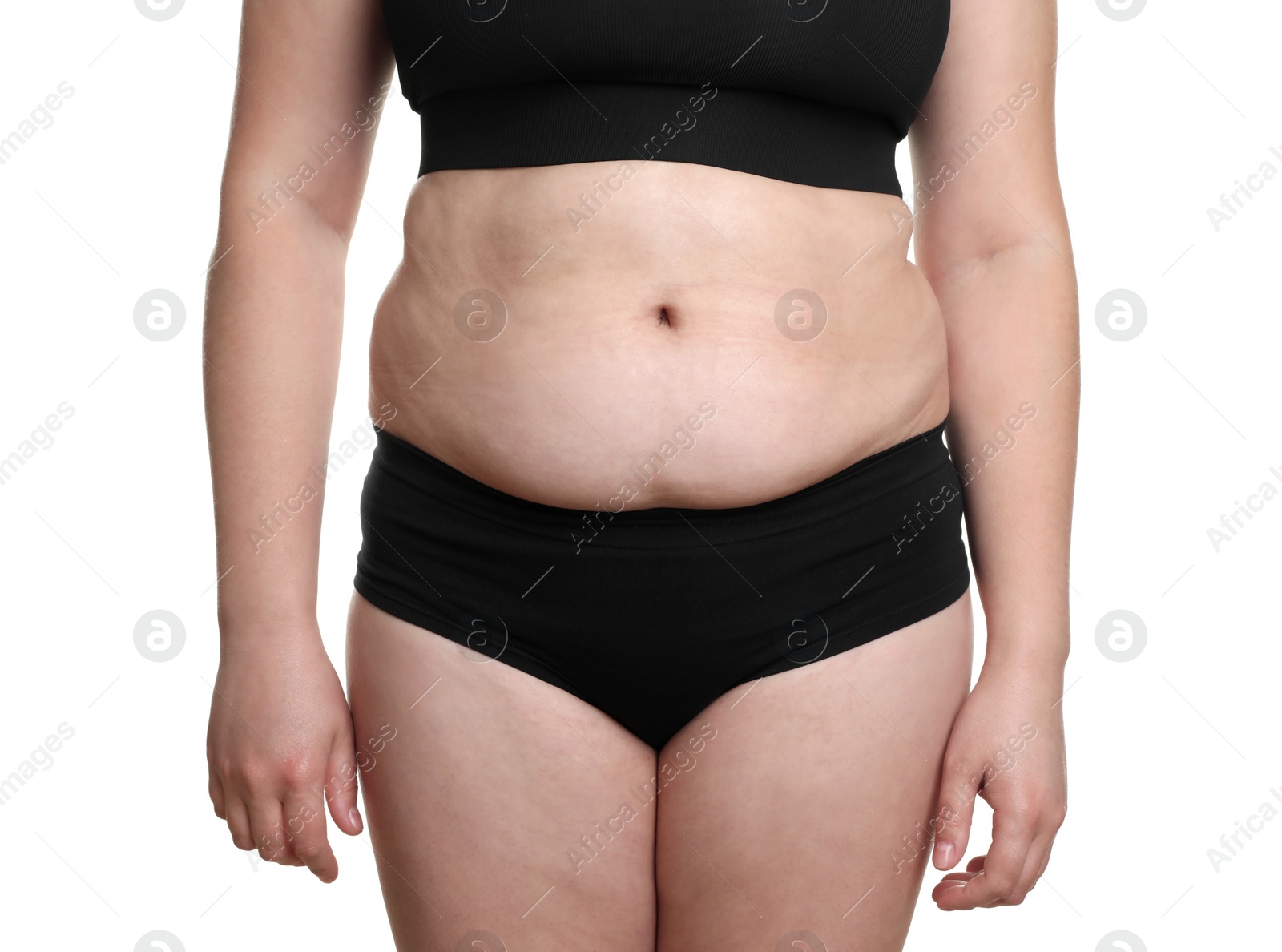 Photo of Woman with excessive belly fat on white background, closeup. Overweight problem