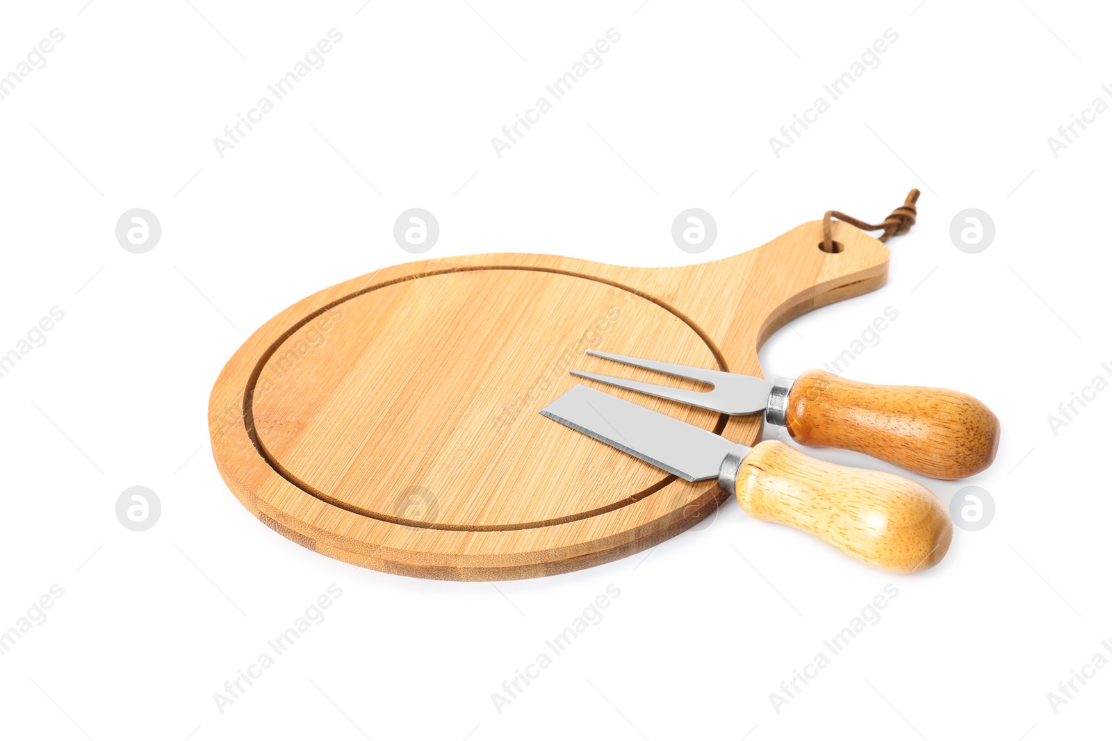 Photo of New wooden board and cheese utensils on white background