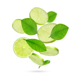 Image of Fresh lime slices and green leaves falling on white background