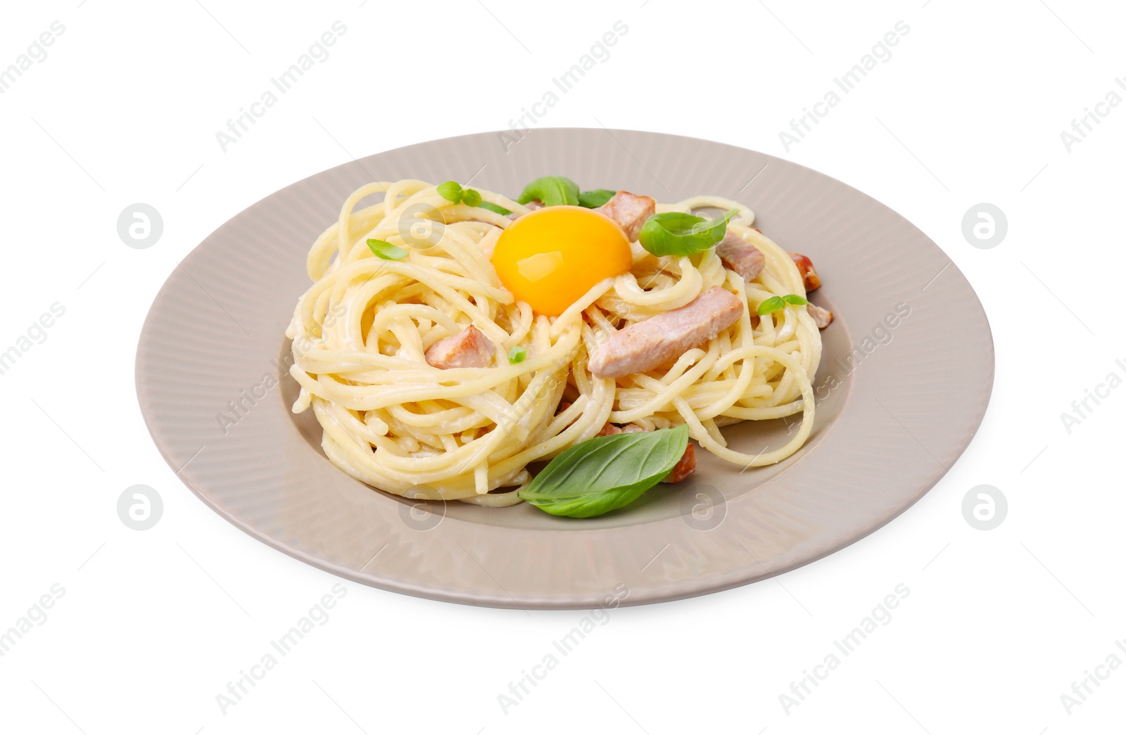Photo of Plate of delicious pasta Carbonara with egg yolk isolated on white