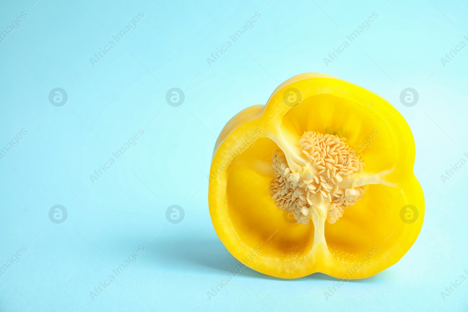 Photo of Cut ripe paprika pepper on color background