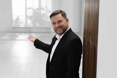 Photo of Male real estate agent showing new apartment