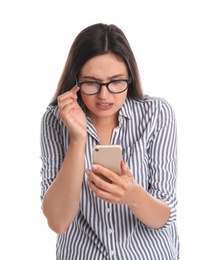 Young woman with glasses using mobile phone on white background. Vision problem