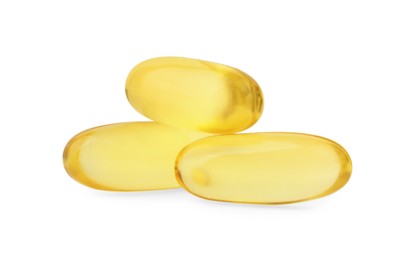 Photo of Yellow vitamin capsules isolated on white. Health supplements