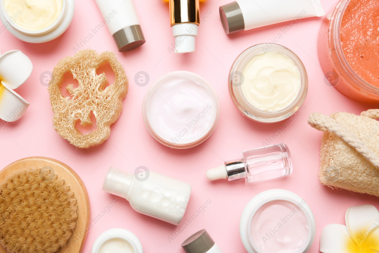 Photo of Flat lay composition with body care products on color background