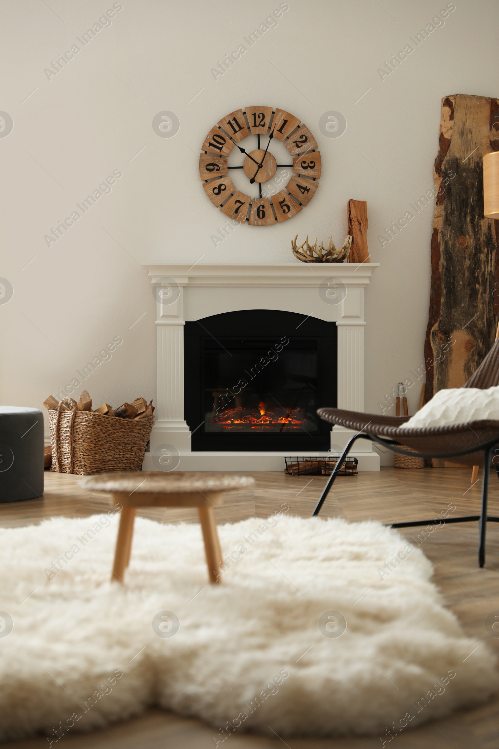 Photo of Beautiful view of cozy living room interior with modern fireplace