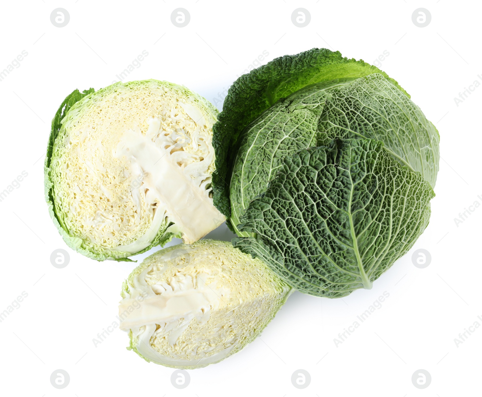 Photo of Whole and cut savoy cabbage isolated on white, top view