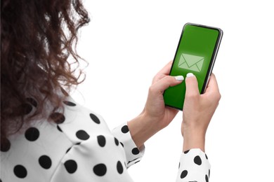 Woman checking new message on mobile phone against white background, closeup