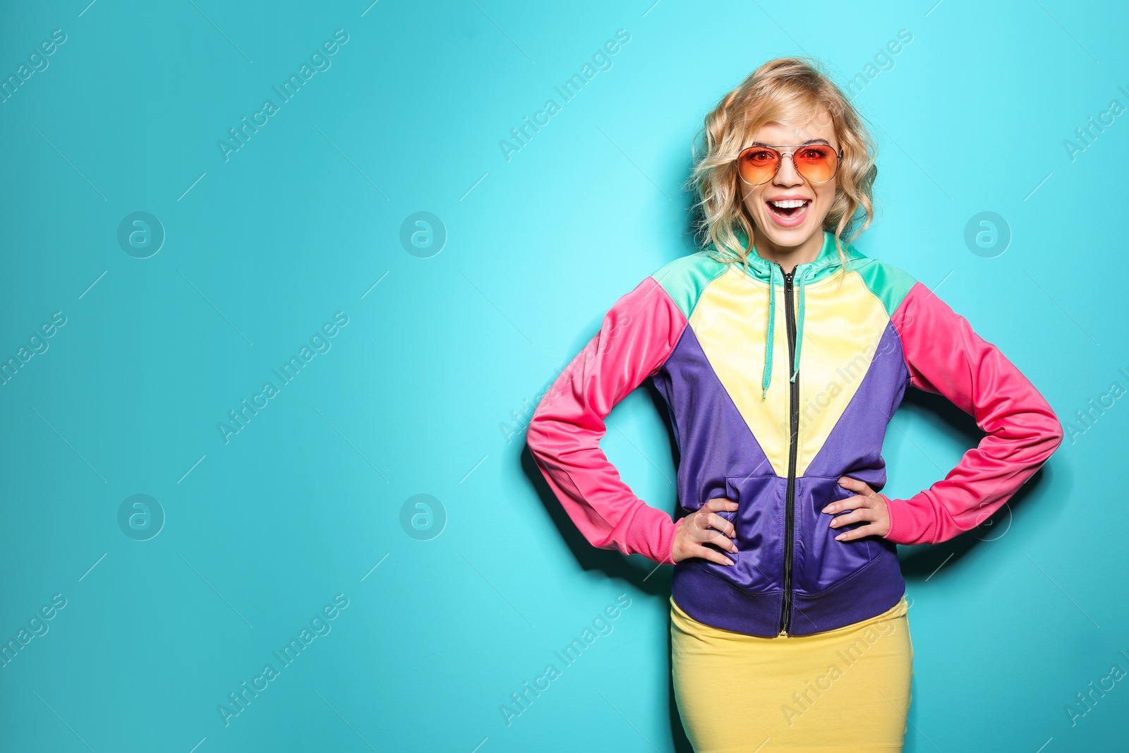 Photo of Stylish young woman posing on color background