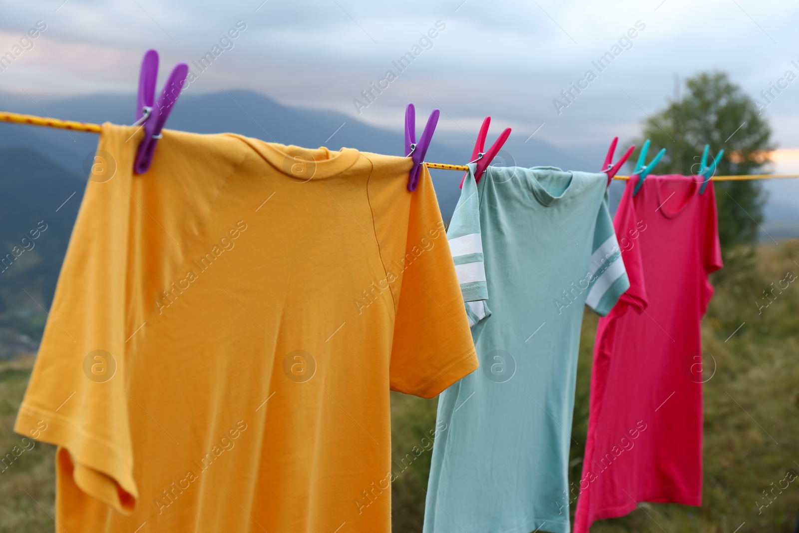 Photo of Clothes hanging on washing line in mountains