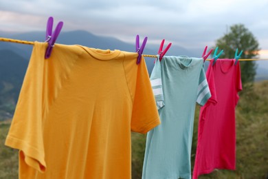 Photo of Clothes hanging on washing line in mountains