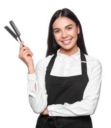 Photo of Portrait of happy hairdresser with professional combs on white background