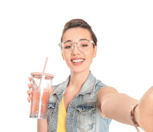 Photo of Young beautiful woman taking selfie against white background