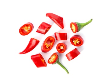 Photo of Slices of red chili peppers on white background, top view