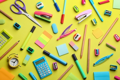 School stationery on yellow background, flat lay. Back to school