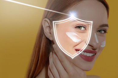 Sun protection care. Beautiful woman with sunscreen on face against golden background. Illustration of shield as SPF