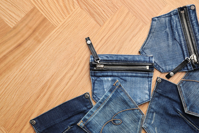 Photo of Flat lay composition with jeans pockets on table. Space for text
