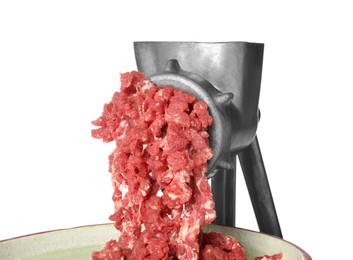 Metal meat grinder with minced beef and plate isolated on white