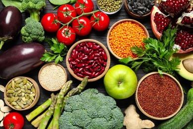 Different vegetables, seeds and fruits on table, flat lay. Healthy diet