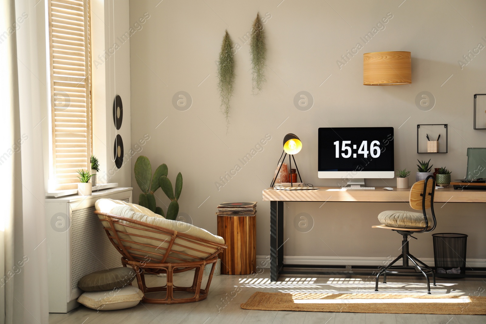 Photo of Room interior with comfortable workplace. Modern computer on wooden desk