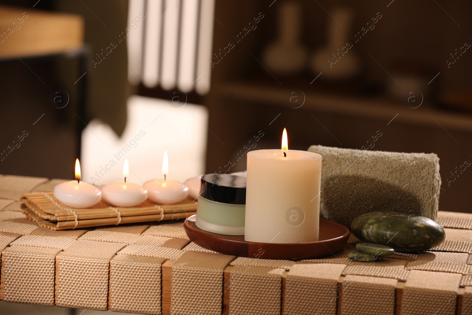 Photo of Beautiful composition with different spa products on wicker bench indoors