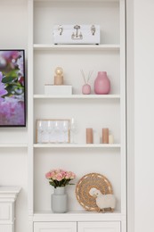 Photo of Shelves with different decor indoors. Interior design