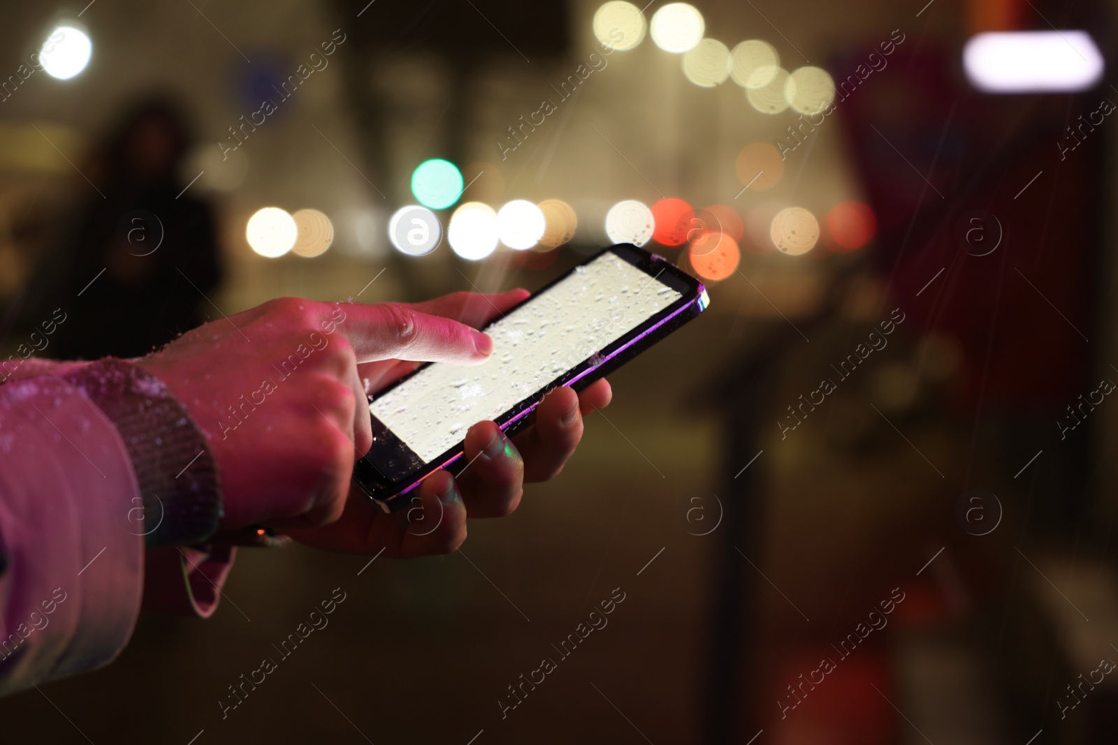 Photo of Man using smartphone on night city street, closeup. Space for text