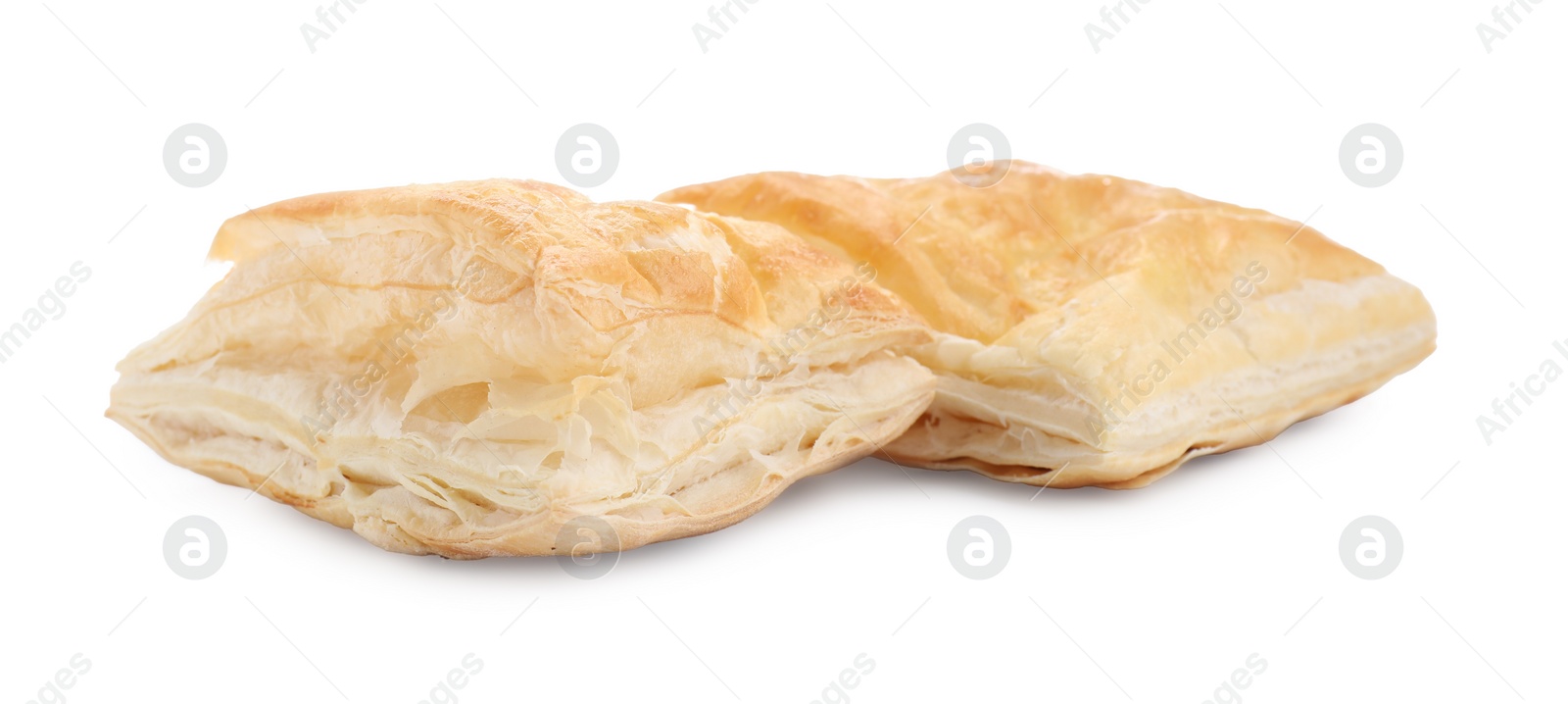 Photo of Delicious fresh puff pastries isolated on white