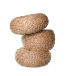 Photo of Three stylish wicker poufs on white background