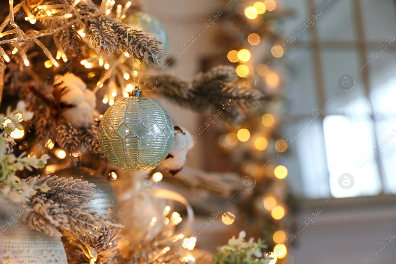 Photo of Closeup view of beautiful decorated Christmas tree indoors