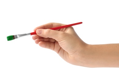 Photo of Young woman holding brush with color paint on white background, closeup