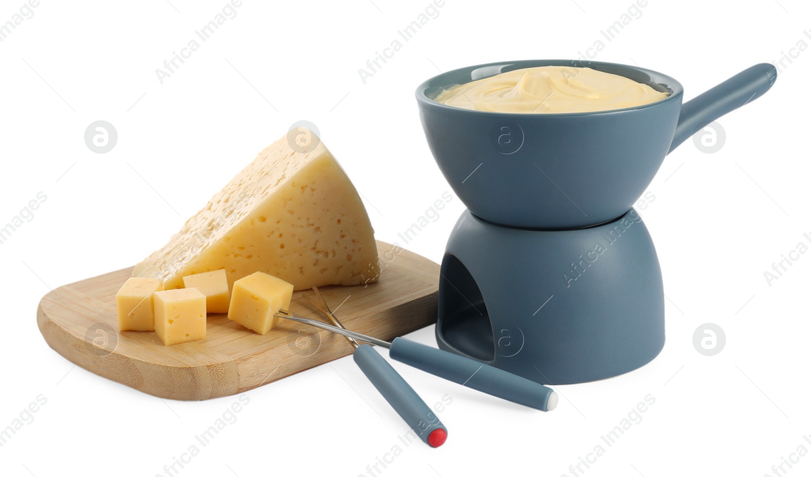 Photo of Fondue with tasty melted cheese, forks and pieces isolated on white