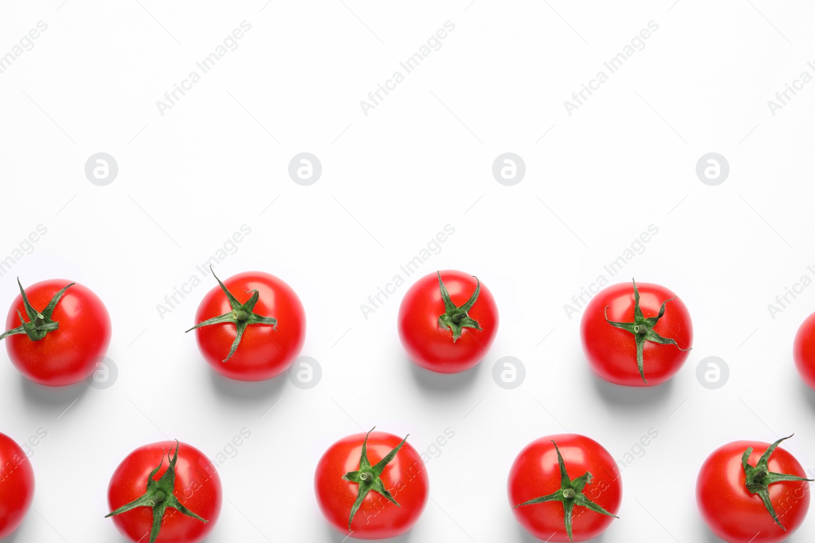 Photo of Composition with ripe cherry tomatoes on white background, top view