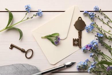 Photo of Flat lay composition with beautiful Forget-me-not flowers on white wooden table