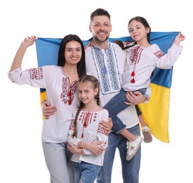 Happy family in national clothes with flag of Ukraine on white background
