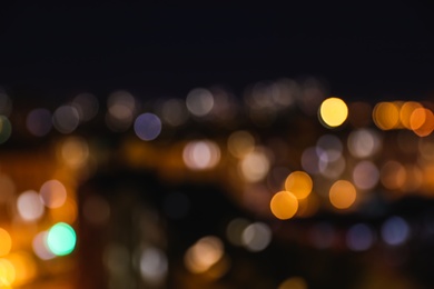 Photo of Blurred view of modern city at night. Bokeh effect