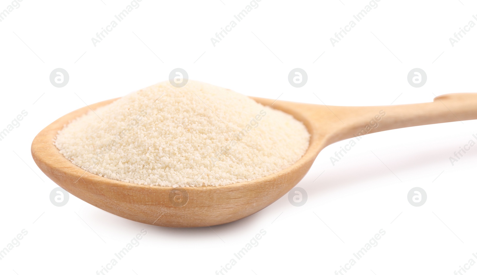 Photo of Spoon with organic semolina on white background, closeup