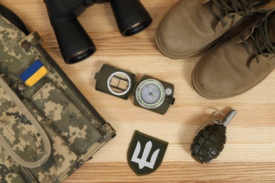 MYKOLAIV, UKRAINE - SEPTEMBER 26, 2020: Tactical gear and Ukrainian military uniform on table, flat lay